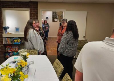 Attendees of a past event gather to chat.